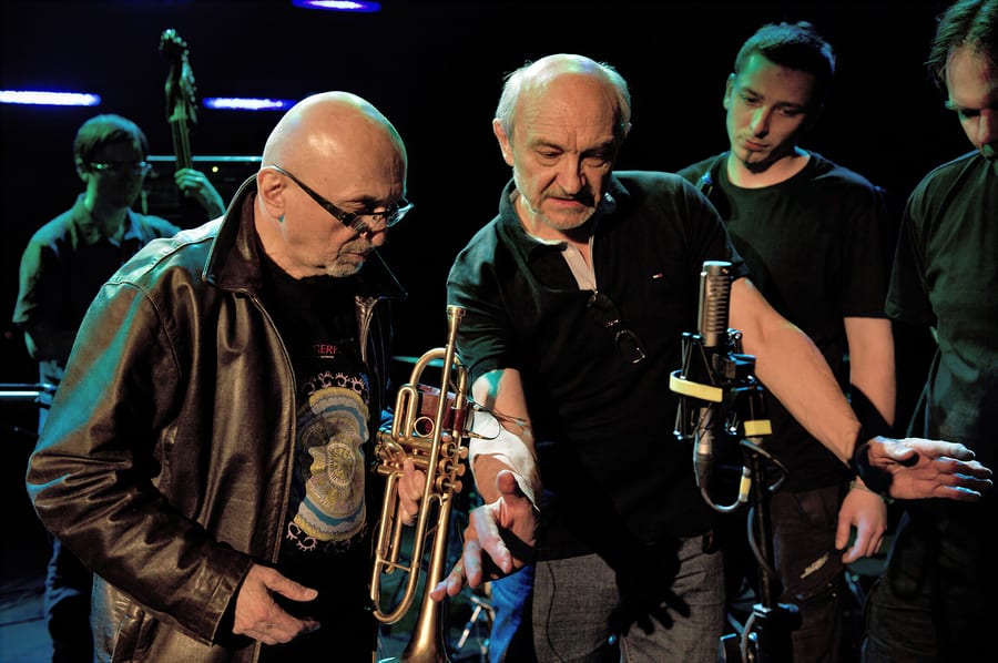 Andrew Lipinski setting microphone placement during a recording session with trumpeter Tomasz Stańko